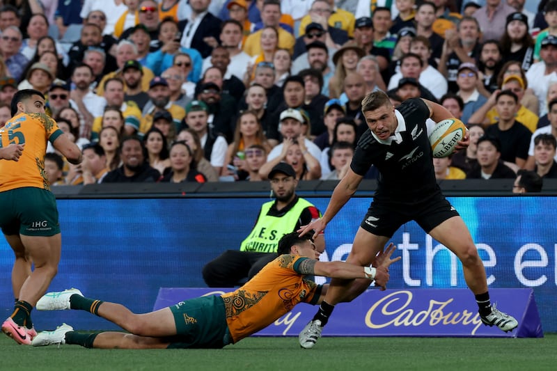 New Zealand's Cortez Ratima is tackled by Australia's Noah Lolesio during their Rugby Championship Test match at Stadium Australia in Sydney. Photograph: Saeed Khan/AFP via Getty Images
