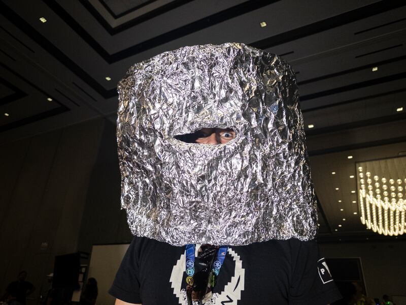 Mark Milhouse wearing a tinfoil hat at Defcon. Photograph: Mikayla Whitmore/The New York Times