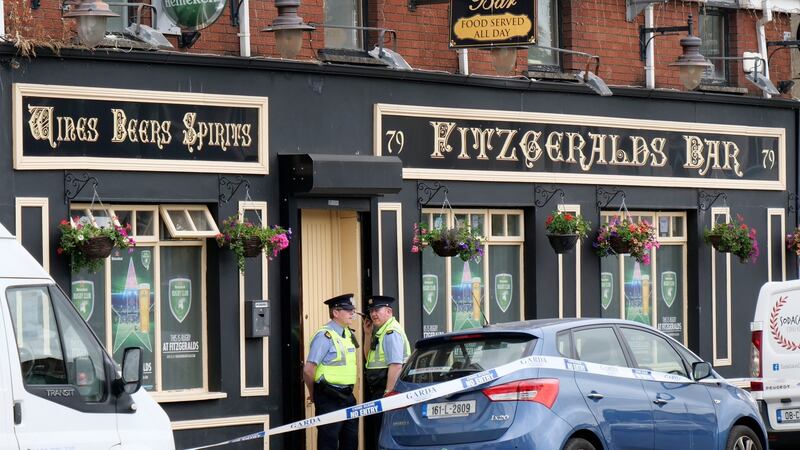 Gardaí at the scene at Fitzgerald’s Bar, Sexton Street North, Limerick City where Patrick O’Connor was fatally stabbed. Photograph: Don Moloney / Press 22