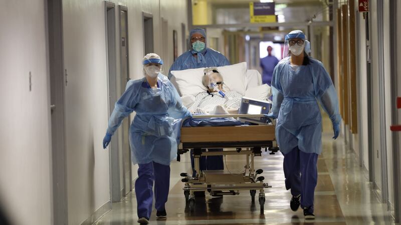 A Covid patient is transferred along a corridor in St Vincents University Hospital, Dublin in April. Photograph: Alan Betson