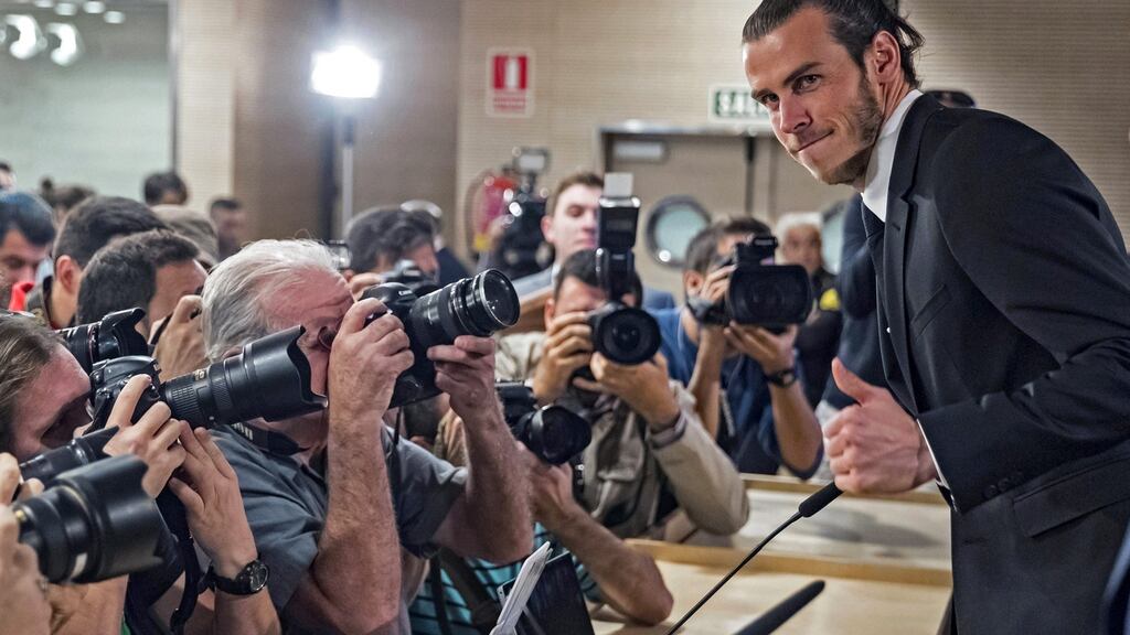 Real Madrid’s Welsh midfielder Gareth Bale poses during a press conference held at the Santiago Bernabeu stadium, in Madrid, Spain. It was announced that Real Madrid extends the contract with Bale until 2022. Photo: Emilio Naranjo/EPA