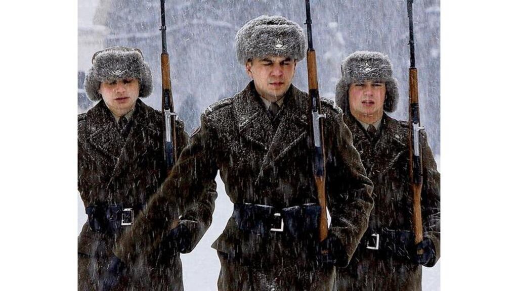 Soldiers return to duty at the tomb of the unknown soldier in Warsaw on Wednesday; 122 people have died from the cold in Poland where the temperature has fallen as low as minus 15 degrees. Photograph: Czarek Sokolowski/AP Photo