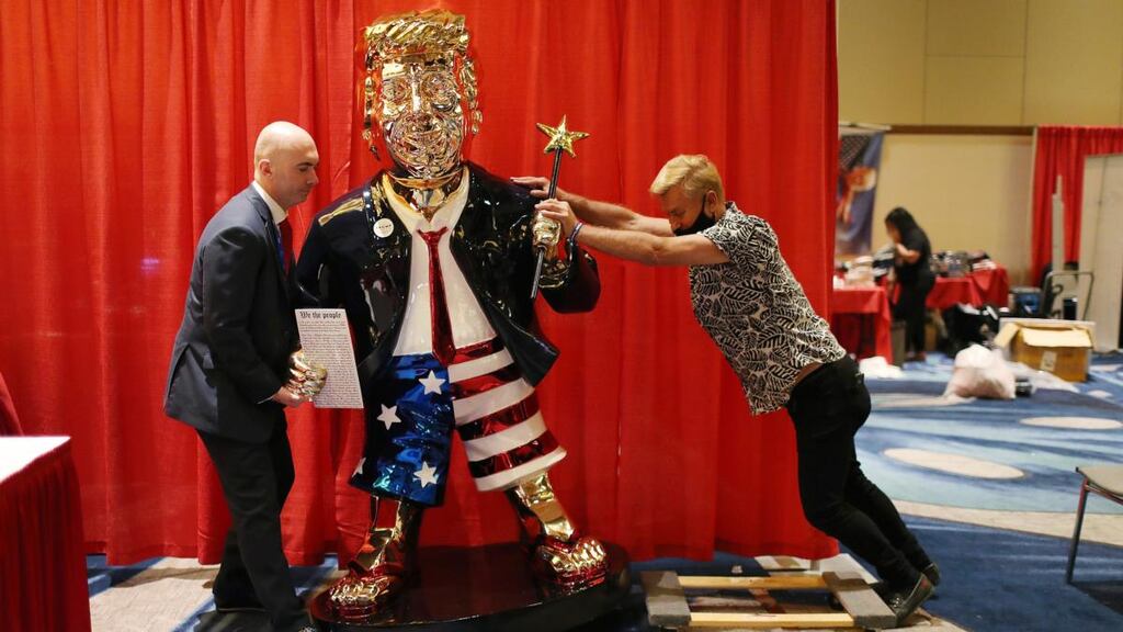 Matt Braynard (left) helps artist Tommy Zegan (right) move his statue of former president Donald Trump to a van during the Conservative Political Action Conference on February 27th, 2021 in Orlando, Florida. Photograph: Joe Raedle/Getty Images