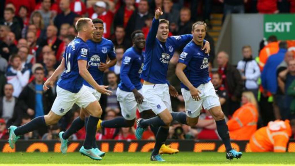 Phil Jagielka (right) of Everton celebrates with teammates after scoring a late goal to level the scores at 1-1 with Liverpool at Anfield. Photograph: Alex Livesey/Getty Images