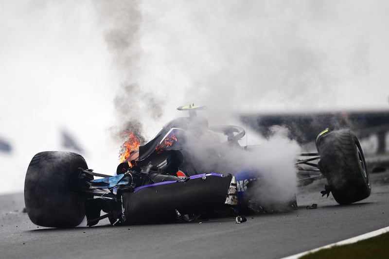 The car of Logan Sargeant on fire after crashing during final practice ahead of the Dutch Grand Prix at Zandvoort. Photograph: Rudy Carezzevoli/Getty Images