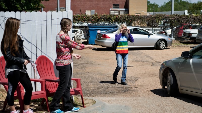A volunteer, right, who escorts patients into the Jackson Women’s Health Organisation, approaches a car as pro-life activists offer literature outside the clinic. Photograph: Brendan Smialowski/AFP via Getty