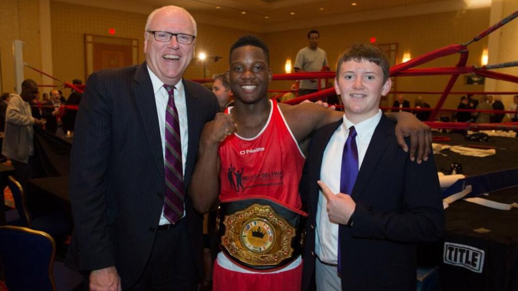 Congressman Joe Crowley with his son Cullen and Jason Bell of NoXcuses Boxing Club.