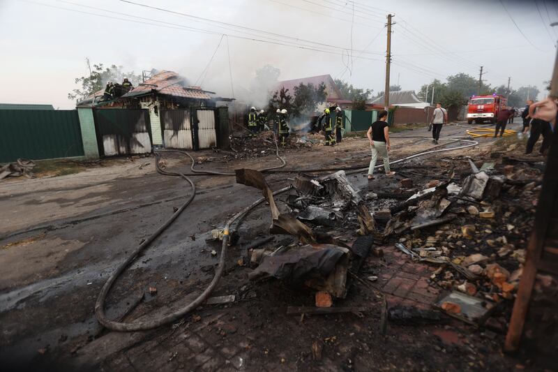 Firefighters work on a site following a missile attack in a village outside Kyiv in August. Photograph: Anatolii Stepanov/AFP