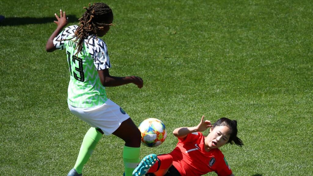 South Korea Lee Mina slides in to tackle Nigeria’s Ngozi Okobi during the Women’s World Cup Group A encounter at Stade des Alpes in Grenoble. Photograph: Denis Balibouse/Reuters