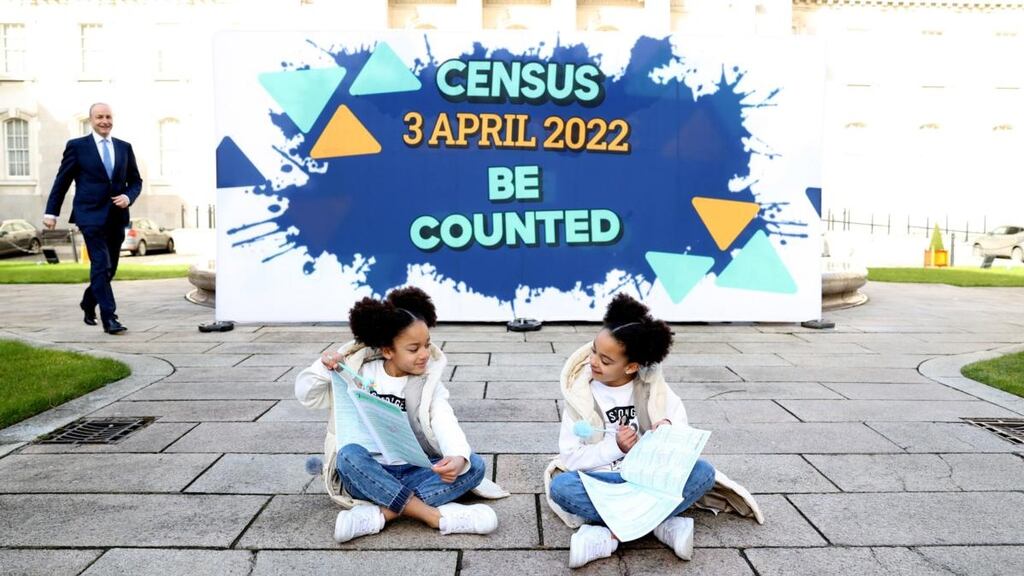 Taoiseach Micheál Martin and Mya and Zara Akinsowon from Baldoyle in Dublin at the launch of the 2022 Census campaign at Government Buildings. Photograph: Jason Clarke
