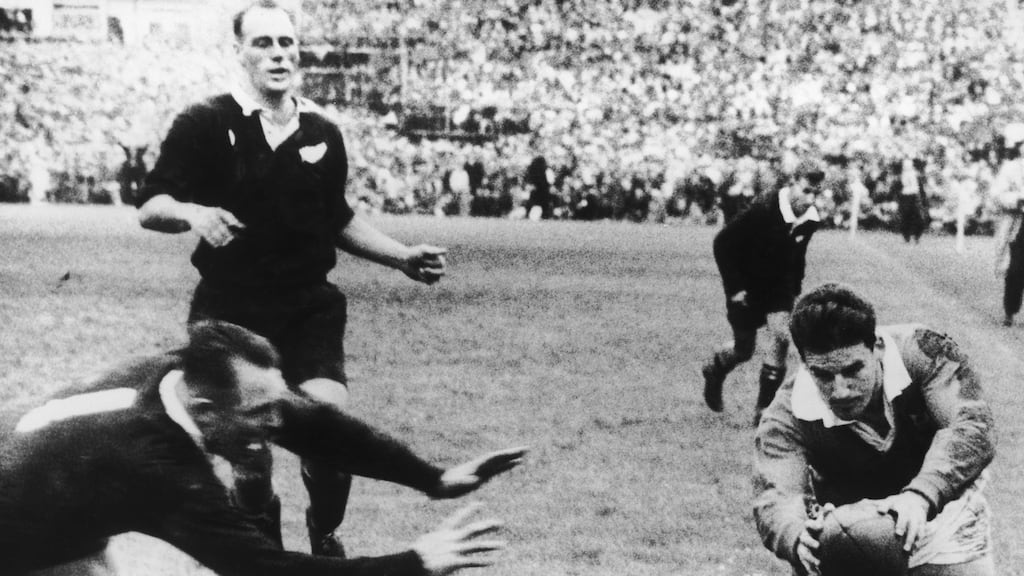 DB Clarke of the All Blacks arrives too late to stop British Lions’ fly-half Bev Risman scoring the winning try at Auckland in September 1959. Photo by Central Press/Hulton Archive/Getty Images)