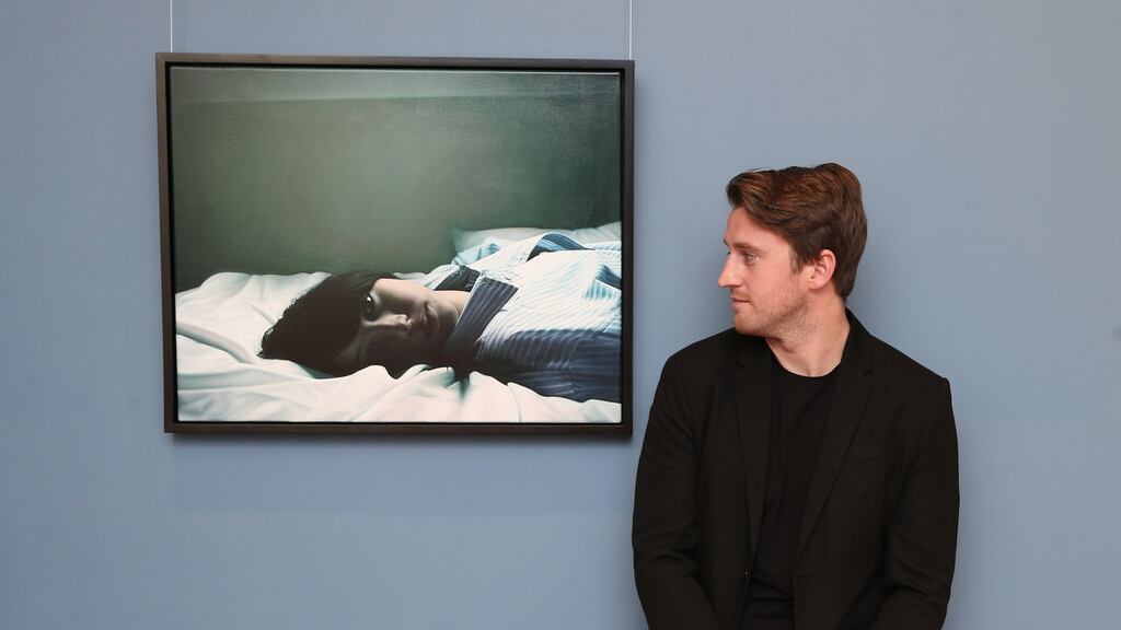 Jack Hickey with his painting My Time, which has won the 2017 Hennessy Portrait Prize
