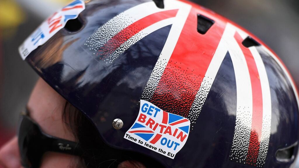 A cyclist wears a pro-Brexit badge on her Union flag themed helmet. Some economists believe Brexit will begin to bite later this year as the weak pound pushes up prices for imports and inflation creeps up