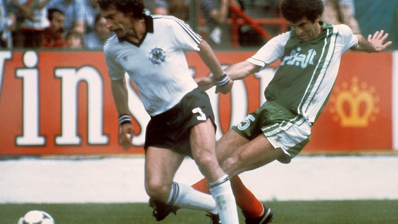 West German defender Paul Breitner under pressure from Algerian midfiedler Mustapha Dahleb. Photograph: Staff/Getty