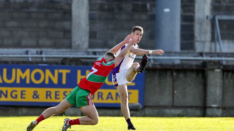 Leon Young tries to block Paul Mannion during the Dublin SFC semi-final. Photograph: Laszlo Geczo/Inpho