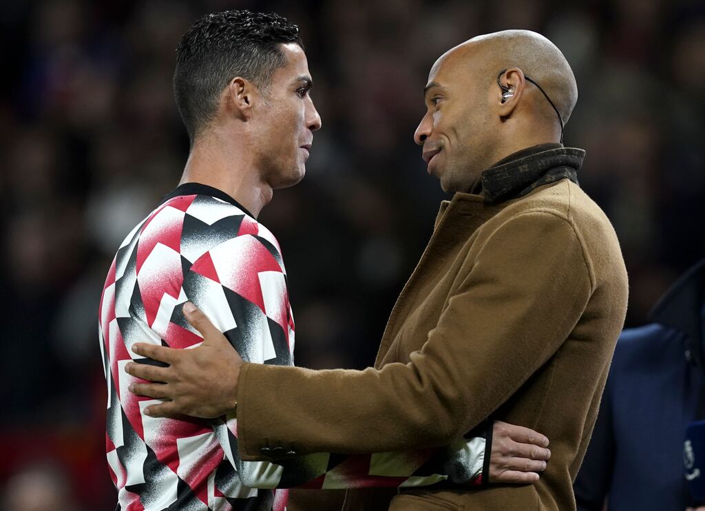 Cristano Ronaldo hugs former Arsenal and France striker Thierry Henry prior to Manchester United's Premier League game against Tottenham Hotspur at Old Trafford on Wednesday. Photograph: Andrew Yates/EPA