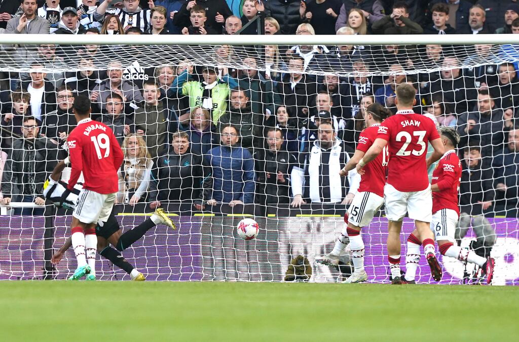 Newcastle United's Joe Willock (left, hidden) scores his side's first goal against Manchester United. Photograph: Owen Humphreys/PA