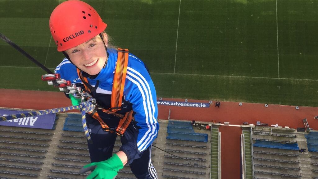 Kate Whyte abseiling from the top of the Hogan Stand for charity. ½”When I couldn’t bend my neck that triggered the alarm bells.”