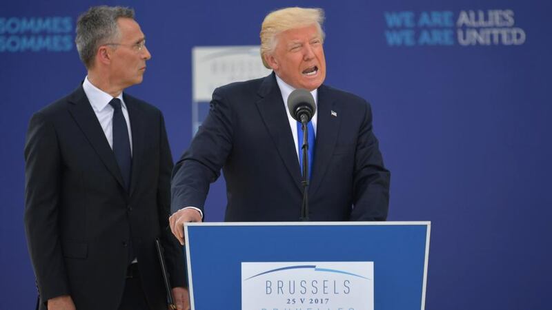US president Donald Trump delivering a speech next to Nato secretary general Jens Stoltenberg during the unveiling ceremony of a Berlin Wall monument at Nato headquarters in Brussels on Thursday. Photograph: Mandel Ngan/AFP/Getty Images