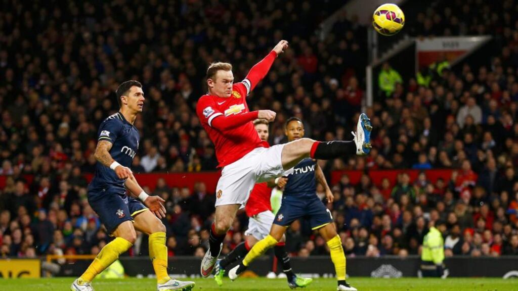 Manchester United’s Wayne Rooney (centre) jumps for the ball as he is challenged by Southampton’s Jose Fonte (left) at Old Trafford. Photograph: Darren Staples / Reuters