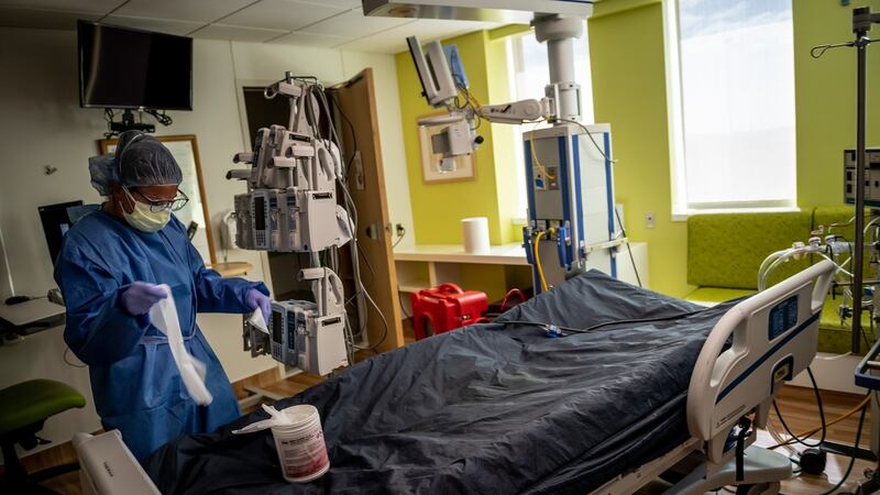 Anne Marie Baker, a nurse at the Children’s Hospital of San Antonio in Texas, disinfects the room of a teenager who had just died from Covid-19. Photograph: Meridith Kohut/The New York Times