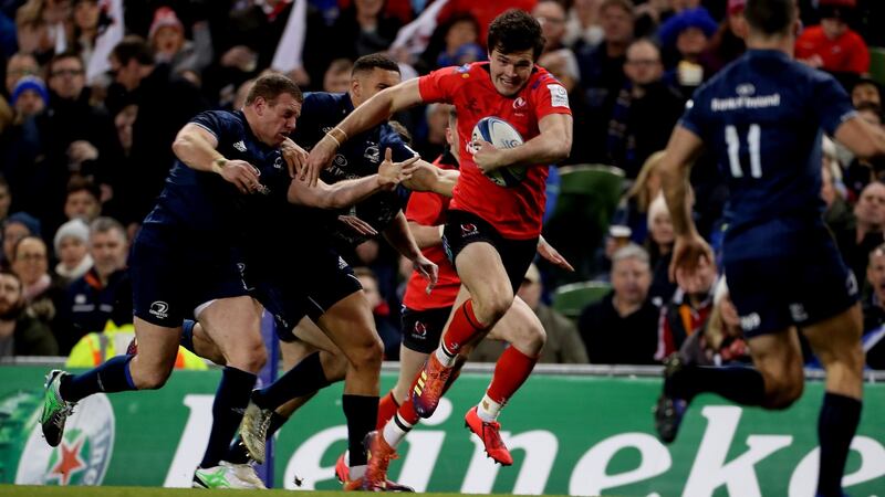 Jacob Stockdale bursts clear to score his try that never was against Leinster. Photograph: Billy Stickland/Inpho