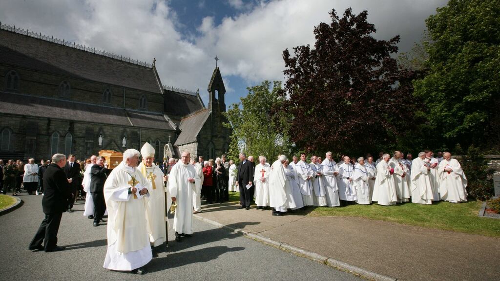 Bishop Christopher Jones and Bishop Brendan Kelly lead the coffin from the Cathedral of the Annunciation. Photograph: Brian Farrell
