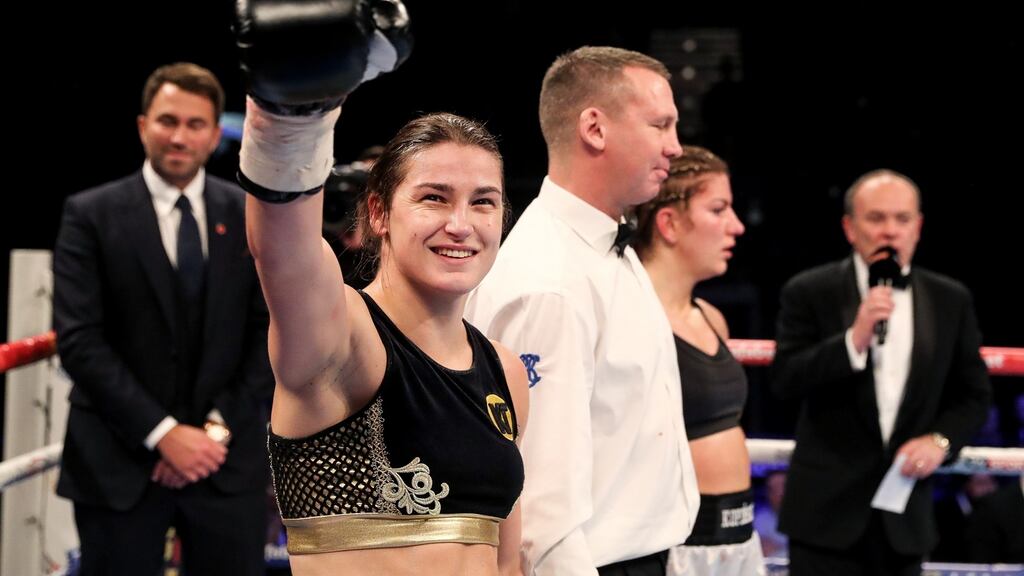 Katie Taylor is declared the winner against Karina Kopinska in London on Saturday. Photograph: Ryan Byrne/Inpho