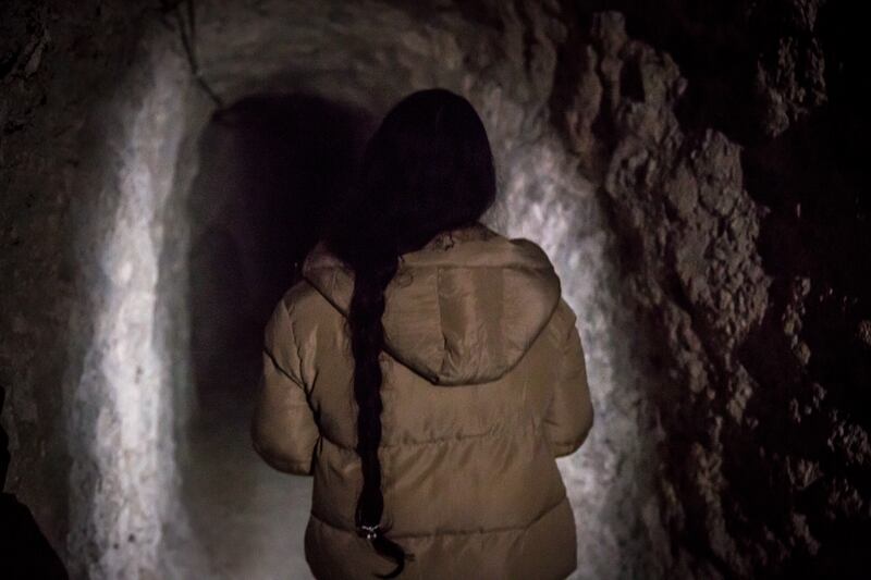 A soldier walks through an underground tunnel in Kobani, northeast Syria. Photograph: Sally Hayden