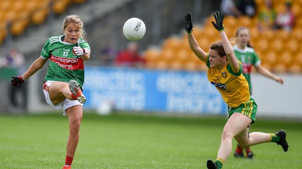 Mayo’s Grace Kelly gets her shot away as Deirdre Foley of Donegal closes in during the TG4 All-Ireland Ladies SFC match at Bord Na Mona O’Connor Park in Tullamore, Offaly. Photograph: Ben McShane/Sportsfile