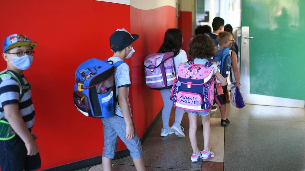 Students with face masks enter their classroom at the Petri primary school in Dortmund, Germany. Face masks are not required in Irish primary schools. Photograph: Ina Fassbender/AFP
