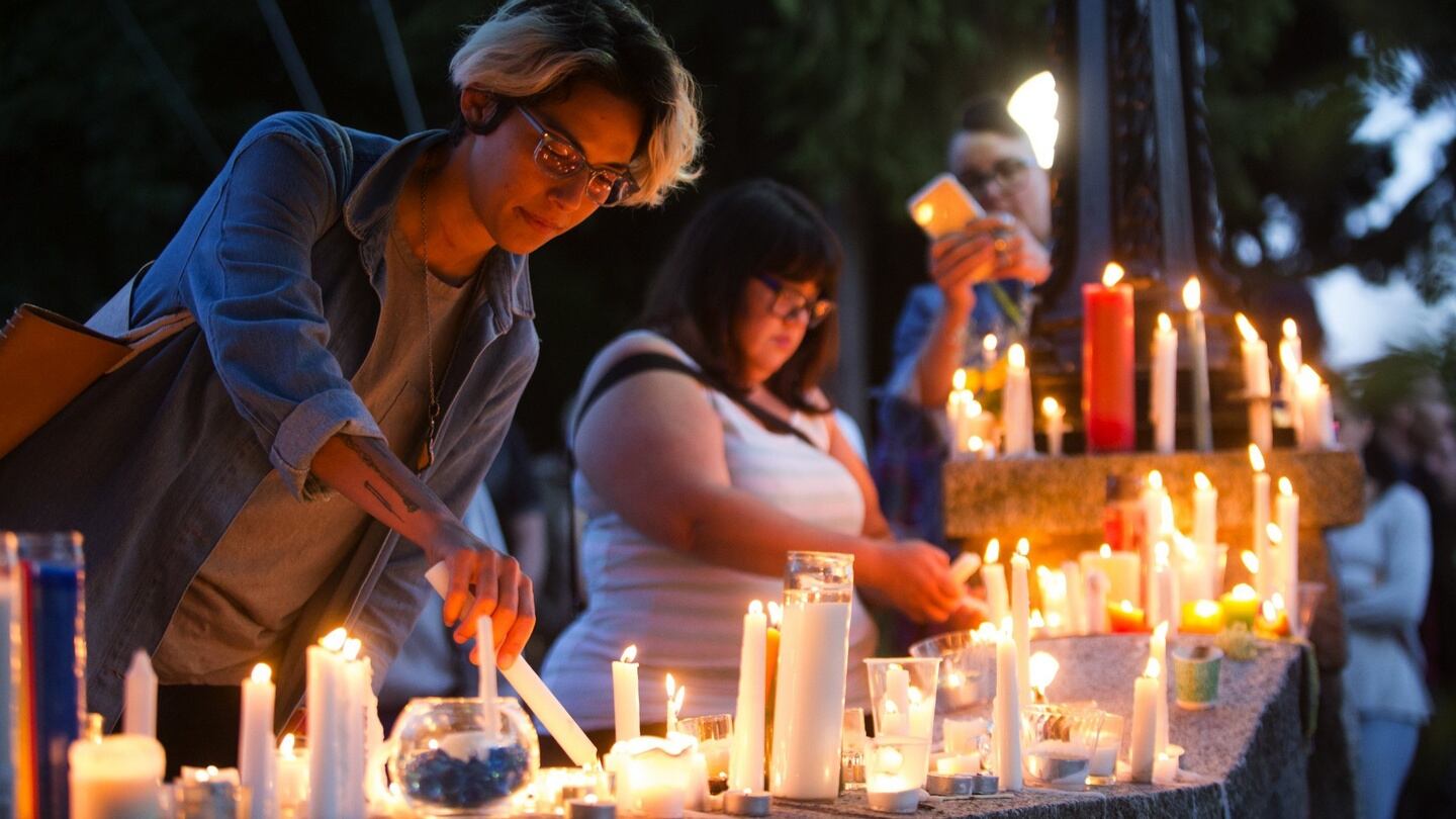 People light candles to add to a growing memorial outside of Cal Anderson Park to honour the Orlando shooting victims in Seattle on Sunday, June 12th, 2016. Photograph: Lindsey Wasson/The Seattle Times via AP