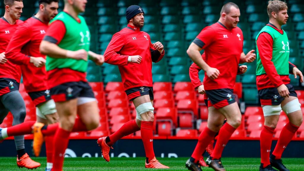 Wales’ captain Alun Wyn Jones (centre) participates with team-mates in the captain’s run training session at the Principality stadium in Cardiff before the Welsh Rugby Union called off tomorrow’s Six Nations game against Scotland. Photograph: Geoff Caddick/AFP via Getty Images)
