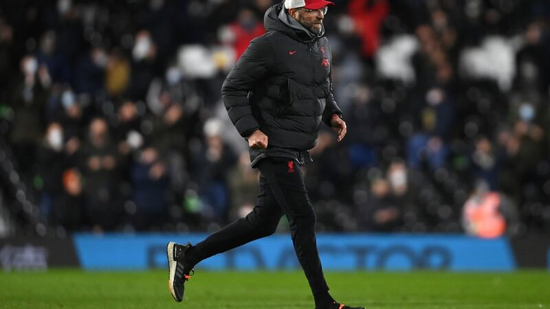 Liverpool manager Jurgen Klopp runs across the pitch towards the tunnel at half time at Craven Cottage. Photograph: PA