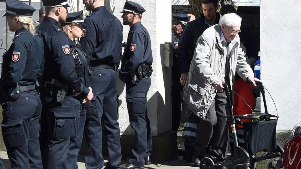 ‘The argument over putting nonagenarians on trial overlooks one group who will never stand trial over the Holocaust: the lawyers, civil servants and politicians in the two post-war German states who worked assiduously to prevent such trials ever taking place.’ Above, defendant Oskar Gröning(right) leaves the court after the first day of his trial in Lueneburg April 21st, 2015. Photograph: Reuters/Fabian Bimmer