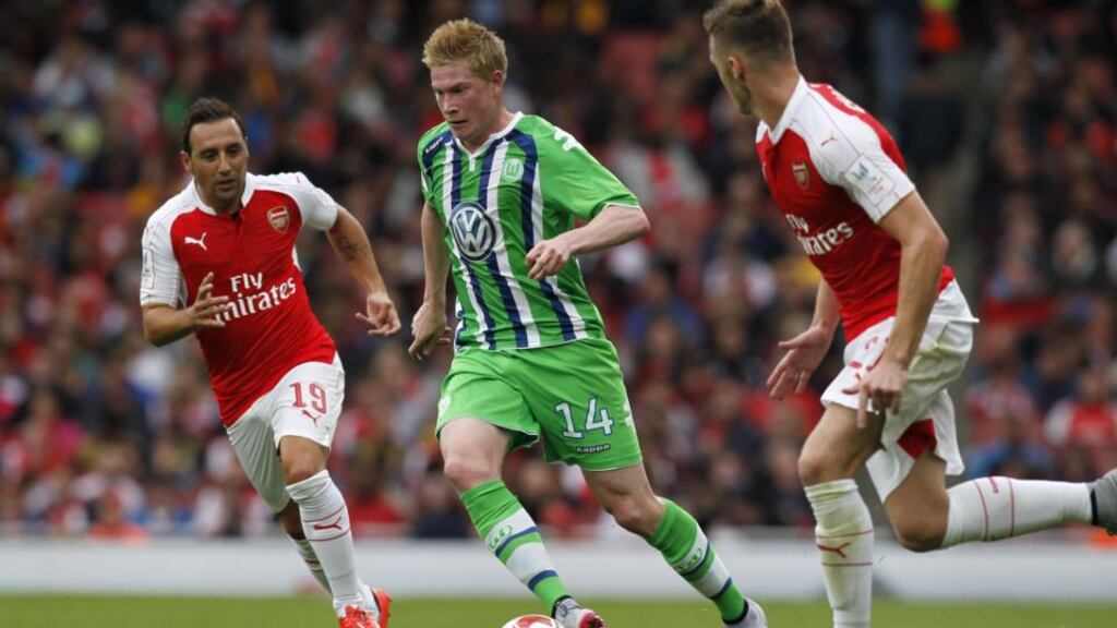 Wolfsburg midfielder Kevin De Bruyne in action against Arsenal’s Santi Cazorla and Calum Chambers during the pre-season friendly at The Emirates. Photograph: Ian King/AFP