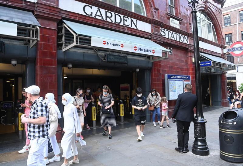 Pedestrians walk out from the London Underground, most still wearing masks, in Covent Garden on July 19th. Photograph: Facundo Arrizabalaga/EPA
