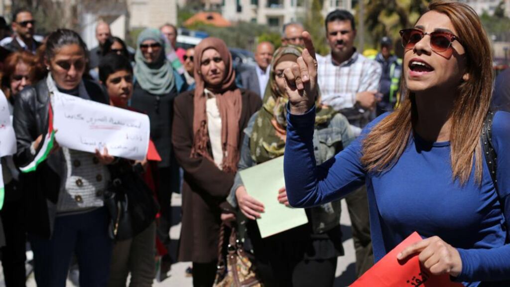 A gathering in solidarity with the Palestinians living in Syria’s Yarmouk camp outside Palestinian Liberation Organisation (PLO) headquarters in the West Bank. Some civilians have been evacuated from the camp following Islamic State gains in Yarmouk. Photograph: Abbas Momani/AFP/Getty Images