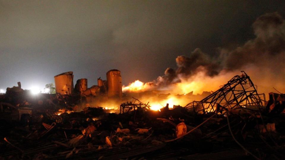 Brandon Smith removes broken glass from the West Thrift Shop in the town of West, near Waco, Texas. Photograph: Mike Stone/Reuters
