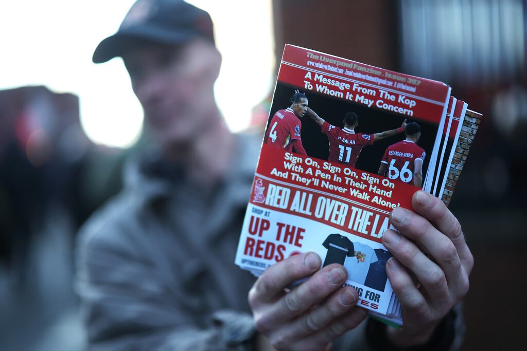 A Liverpool fanzine is seen being sold ahead of the Premier League game against Manchester City last December which features pictures of Virgil van Dijk, Mohamed Salah and Trent Alexander-Arnold. Photograph: Carl Recine/Getty Images