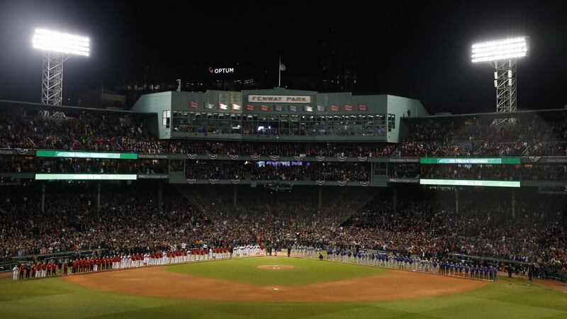 Players line up ahead of the opening game of the World Series between the Boston Red Sox and LA Dodgers at Fenway Park. Photograph: Rhona Wise/EPA