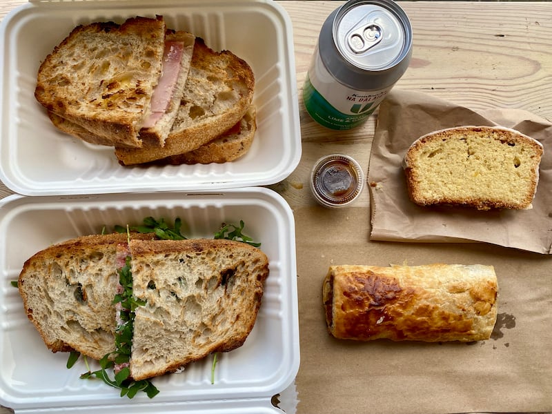 We ordered two toasted sandwiches, a sausage roll and a slice of lemon cake