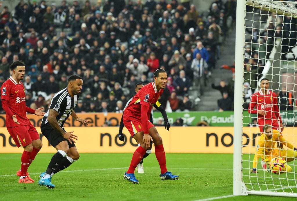 Virgil van Dijk of Liverpool looks dejected as Fabian Schar of Newcastle United scores. Photograph: Stu Forster/Getty