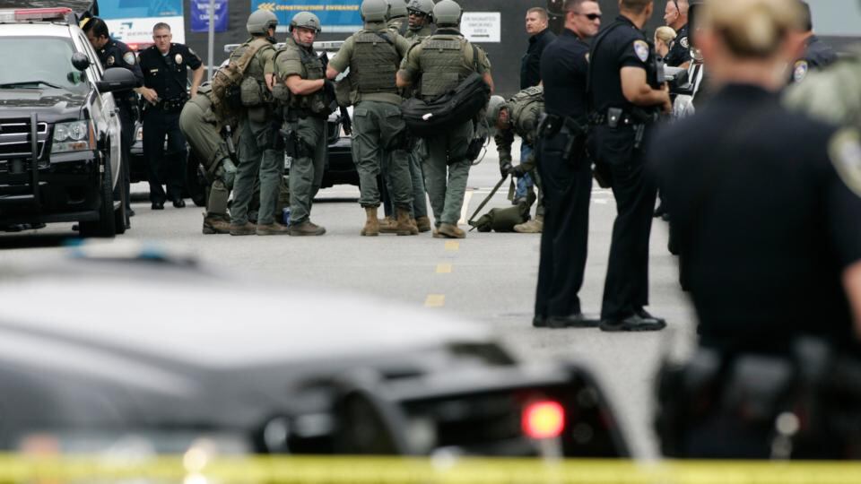Police officers gather during a search at Santa Monica College following a shooting on campus. Photograph: Jonathan Alcorn/Reuters