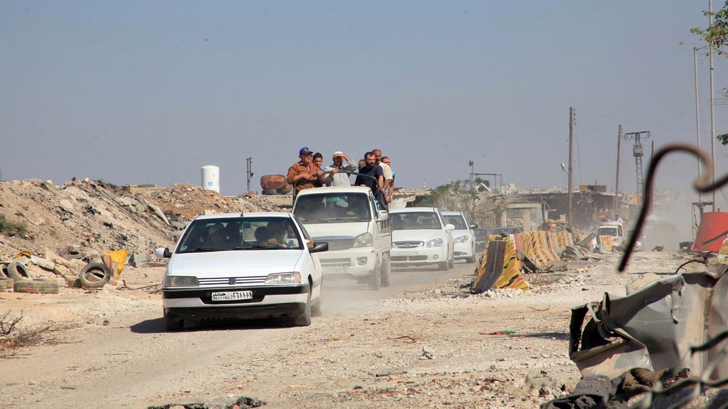People drive in the Ramousah area of southern Aleppo, after the Syrian army and allied militia advanced in the area, Syria, in this handout picture provided by SANA on Friday. Photograph: Sana