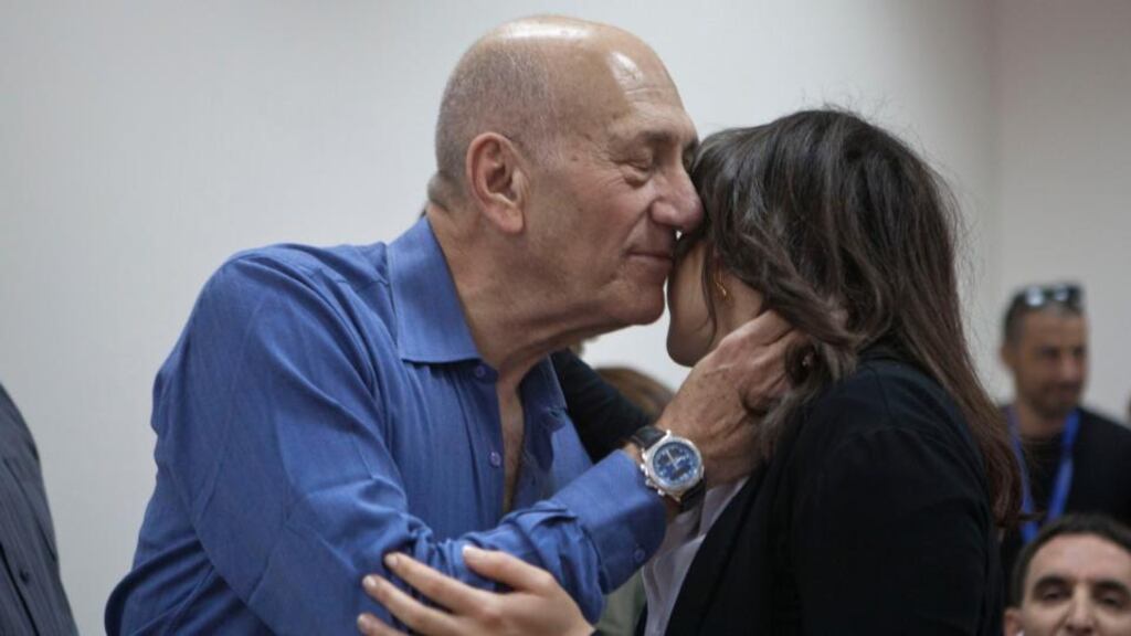Former Israeli prime minister Ehud Olmert embraces a woman at Jerusalem District Court on Monday. Mr Olmert was sentenced to eight months in prison for unlawfully accepting money from a US supporter. Photograph: Heidi Levine/via AP