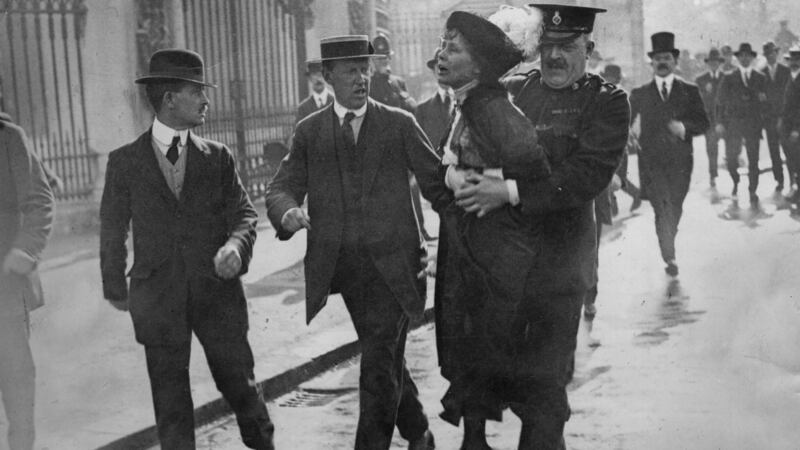 English suffragette Emmeline Pankhurst is arrested and carried away by superintendent Rolfe outside Buckingham Palace at a march organised to petition King George V. Photograph: Jimmy Sime/Central Press/Hulton Archive/Getty Images