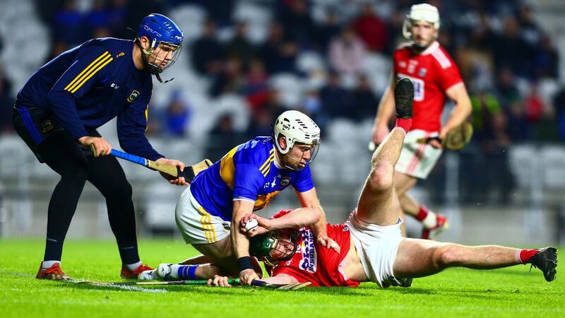 Tipperary’s Seán O’Brien concedes a penalty by fouling Cork’s Robbie O’Flynn. Photo: Ken Sutton/Inpho