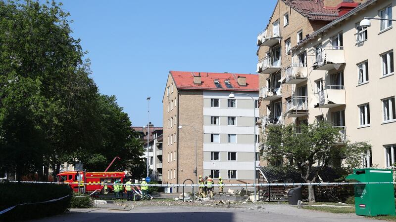 Rescue personnel work outside a block of flats that were reportedly hit by an explosion. Photograph: Jeppe Gustafsson/Seden Out/ EPA