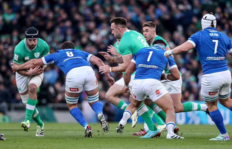 Ireland's Caelan Doris is tackled by Italy's Michele Lamaro. Photograph: Dan Sheridan/Inpho